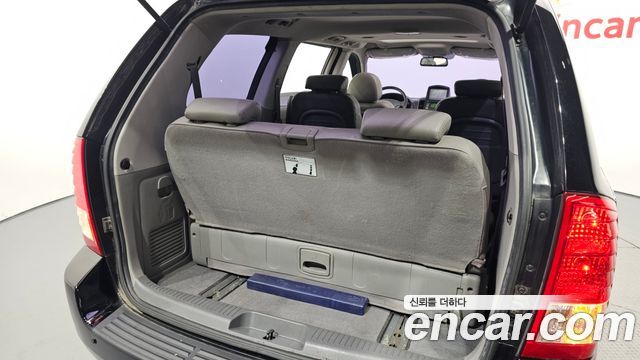 Kia Canival 2012 — photo 31