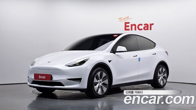 Tesla Model Y 2024 — photo 1