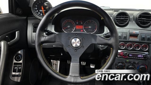 Hyundai Tuscani 2002 — photo 13