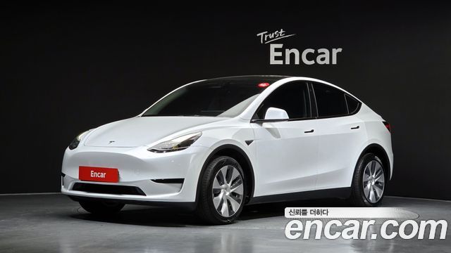 Tesla Model Y 2024 — photo 1