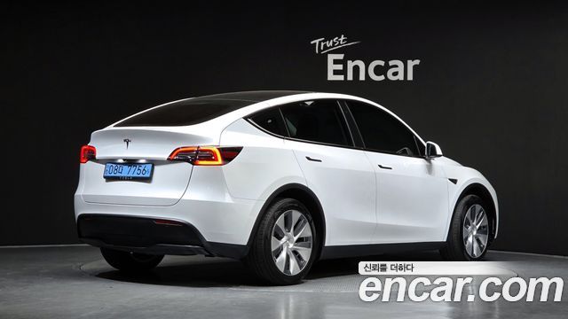 Tesla Model Y 2024 — photo 2