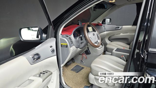 Kia Canival 2013 — photo 13