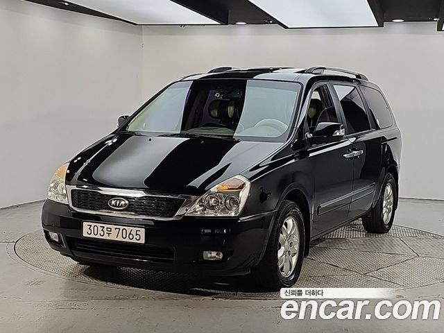 Kia Canival 2012 — photo 1