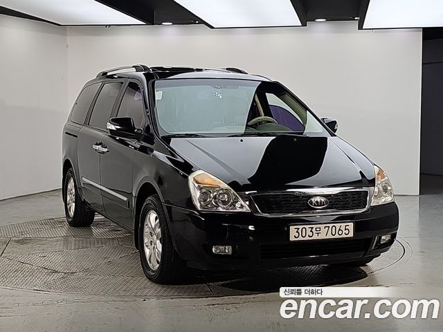 Kia Canival 2012 — photo 2