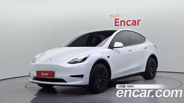 Tesla Model Y 2024 — photo 1