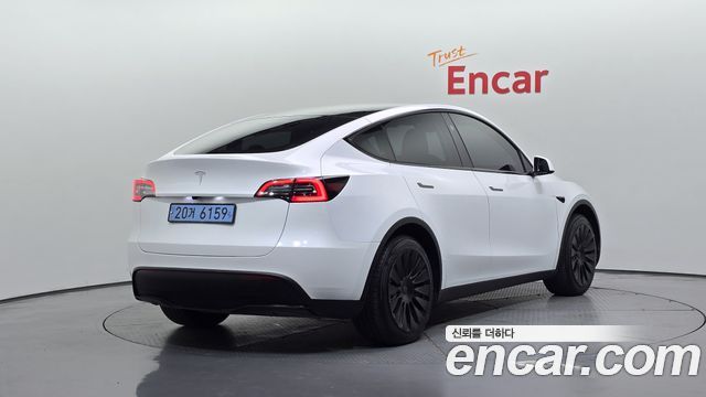Tesla Model Y 2024 — photo 2