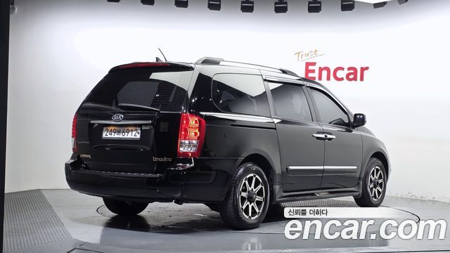 Kia Canival 2012 — photo 2