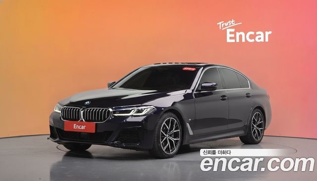 BMW 5-Series 2023 — photo 1