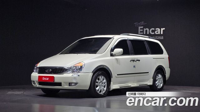 Kia Canival 2010 — photo 1
