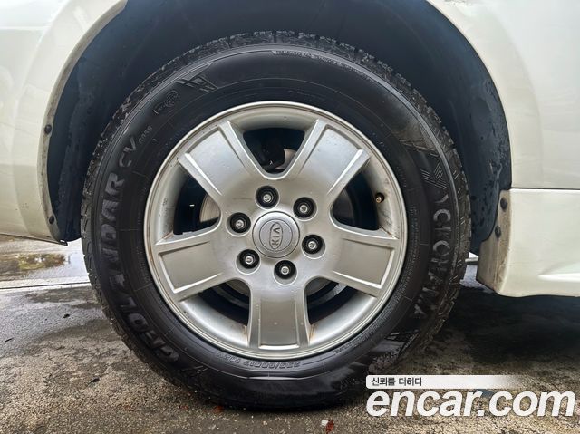 Kia Canival 2010 — photo 7
