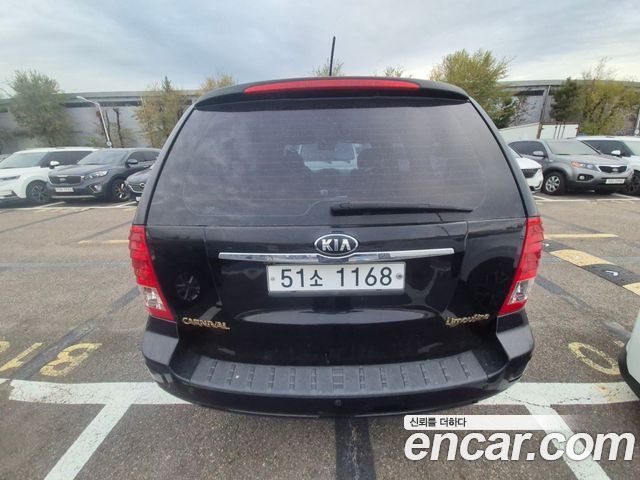Kia Canival 2012 — photo 2