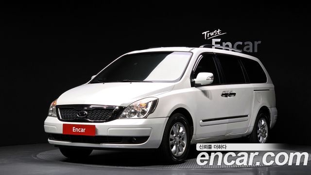 Kia Canival 2012 — photo 1