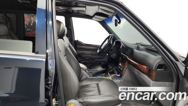 KG Mobility Musso 2000 — photo 11