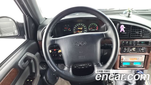 KG Mobility Musso 2000 — photo 13