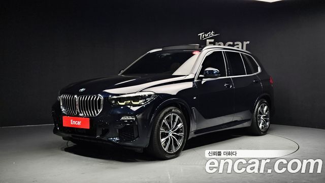 BMW X5 2021 — photo 1