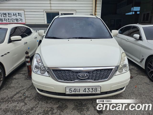 Kia Canival 2010 — photo 1