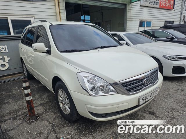 Kia Canival 2010 — photo 2