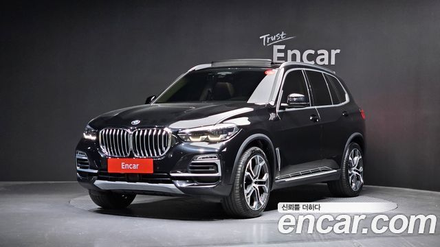 BMW X5 2021 — photo 1