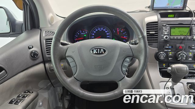 Kia Canival 2013 — photo 13