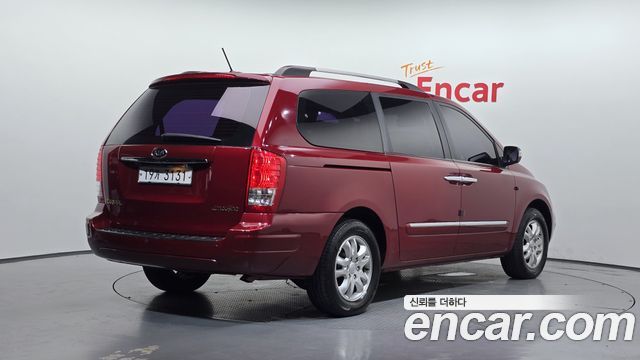 Kia Canival 2011 — photo 2