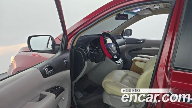 Kia Canival 2011 — photo 13