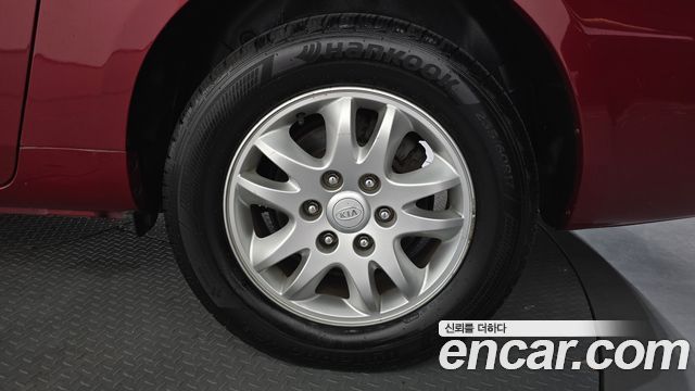 Kia Canival 2011 — photo 7