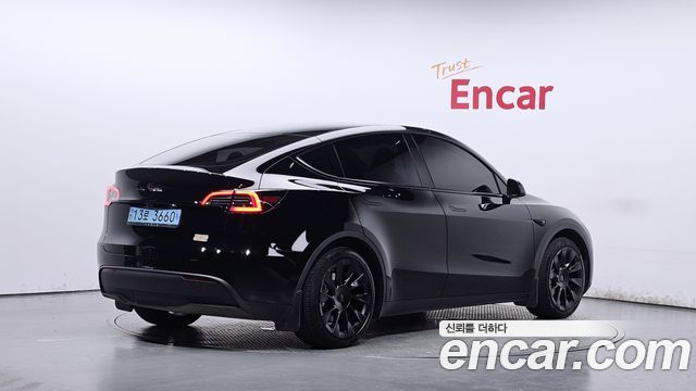 Tesla Model Y 2024 — photo 2