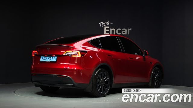 Tesla Model Y 2024 — photo 2