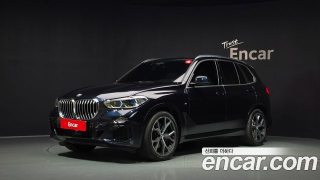 BMW X5 2021 — photo 1