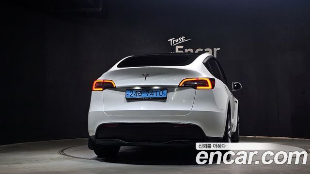 Tesla Model Y 2024 — photo 4