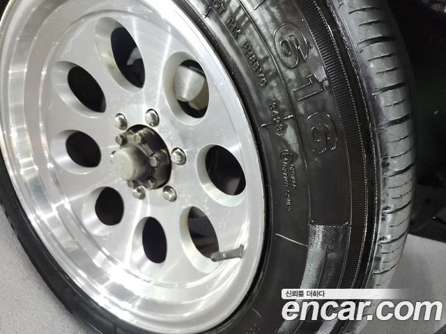 KG Mobility Musso 2004 — photo 14