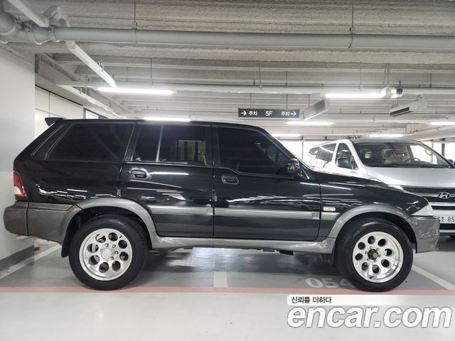 KG Mobility Musso 2004 — photo 20