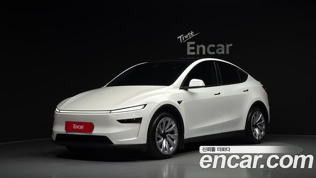 Tesla Model Y 2025 — photo 1