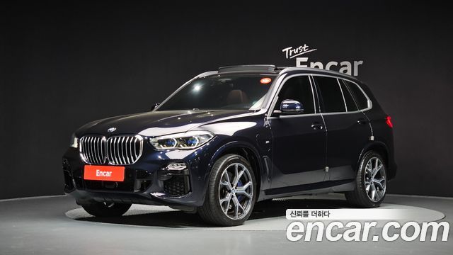 BMW X5 2021 — photo 1