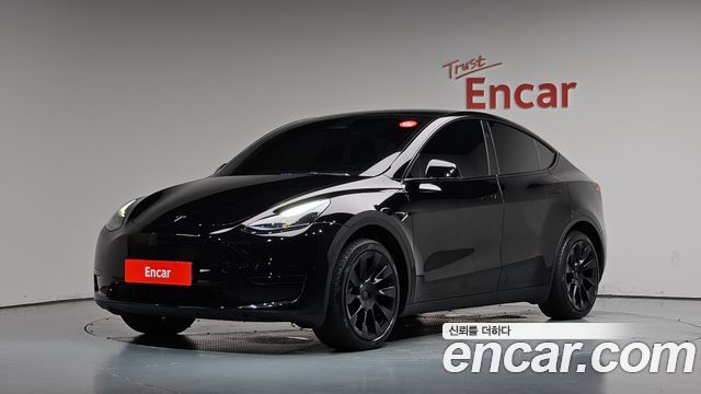 Tesla Model Y 2025 — photo 1