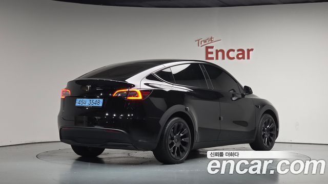 Tesla Model Y 2024 — photo 2