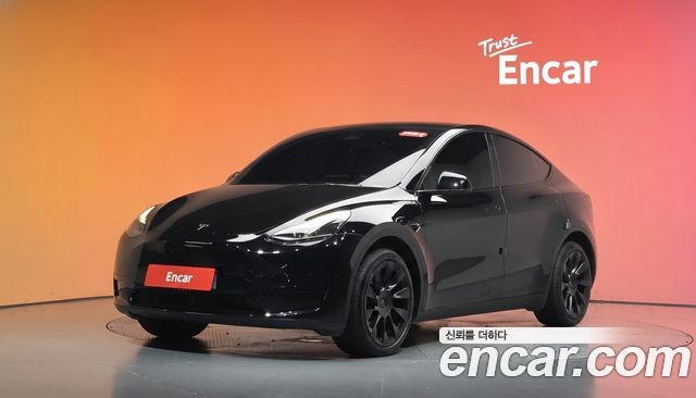 Tesla Model Y 2024 — photo 1