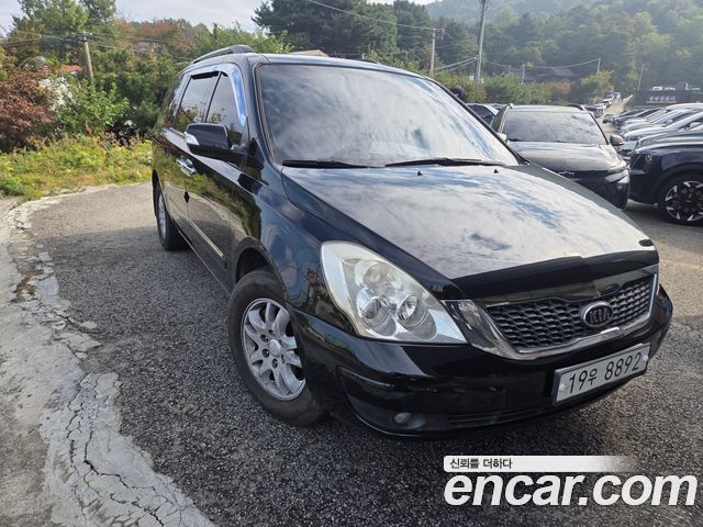 Kia Canival 2011 — photo 2