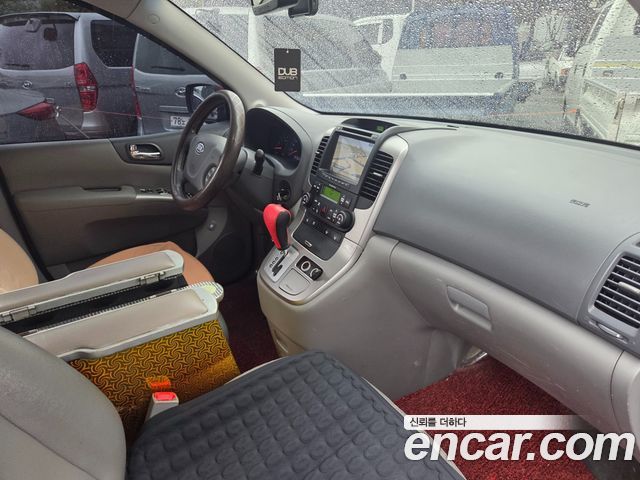 Kia Canival 2012 — photo 16