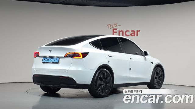 Tesla Model Y 2024 — photo 2