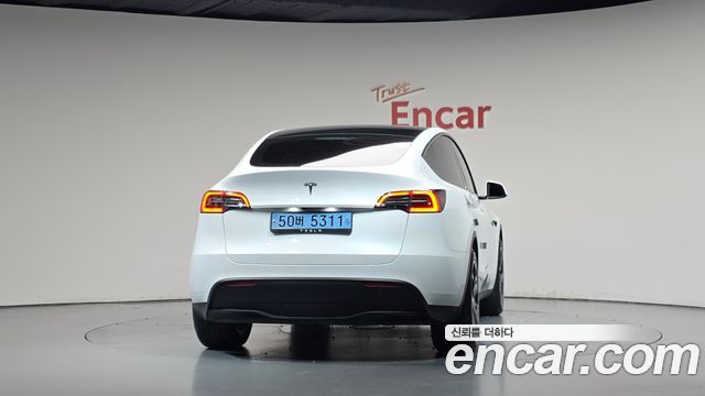 Tesla Model Y 2024 — photo 4