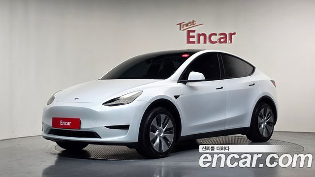 Tesla Model Y 2024 — photo 1