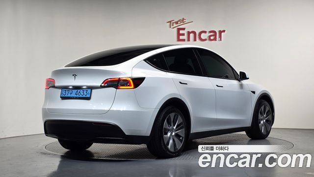 Tesla Model Y 2024 — photo 2