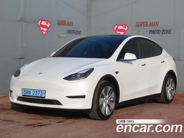 Tesla Model Y 2024 — photo 1