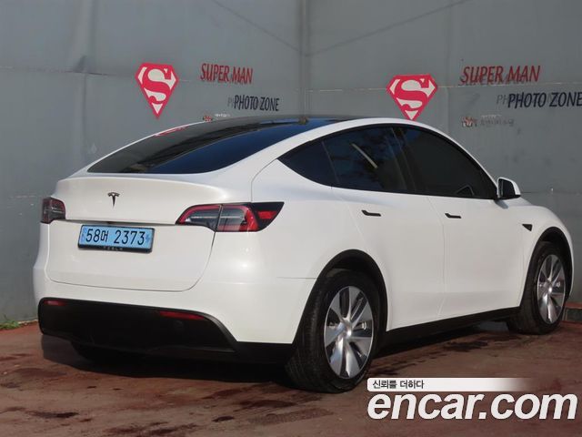 Tesla Model Y 2024 — photo 2