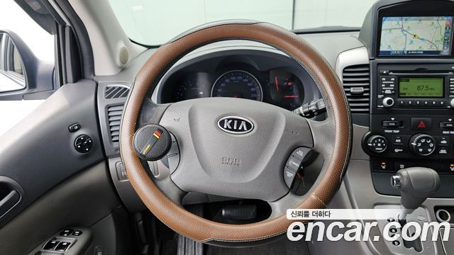 Kia Canival 2012 — photo 13