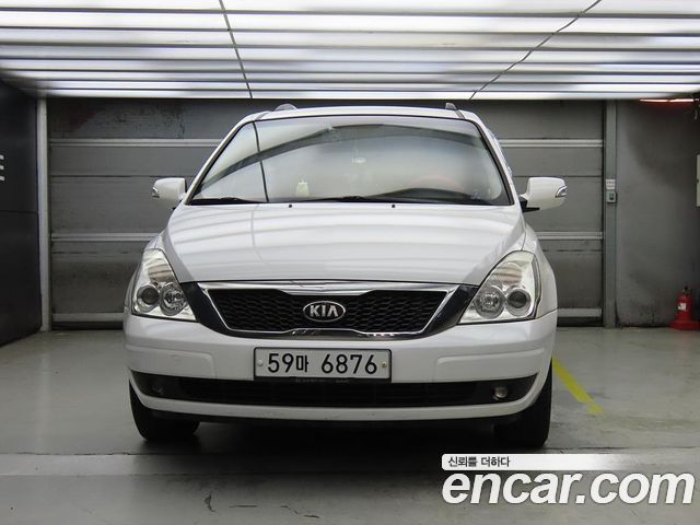 Kia Canival 2013 — photo 2