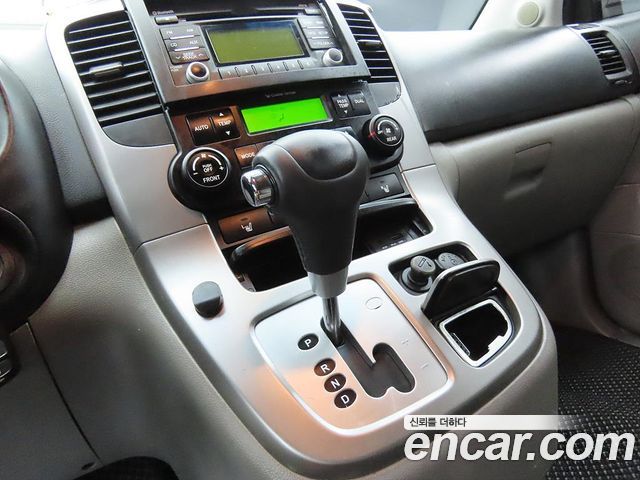 Kia Canival 2013 — photo 11