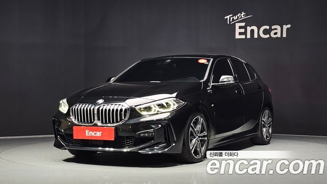BMW 1-Series 2023 — photo 1