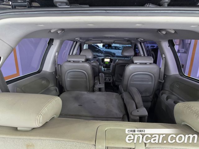 Kia Canival 2010 — photo 12